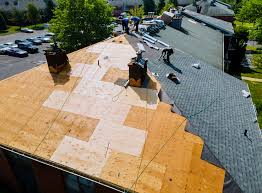 Aerial view of a roof being replaced with new shingles
